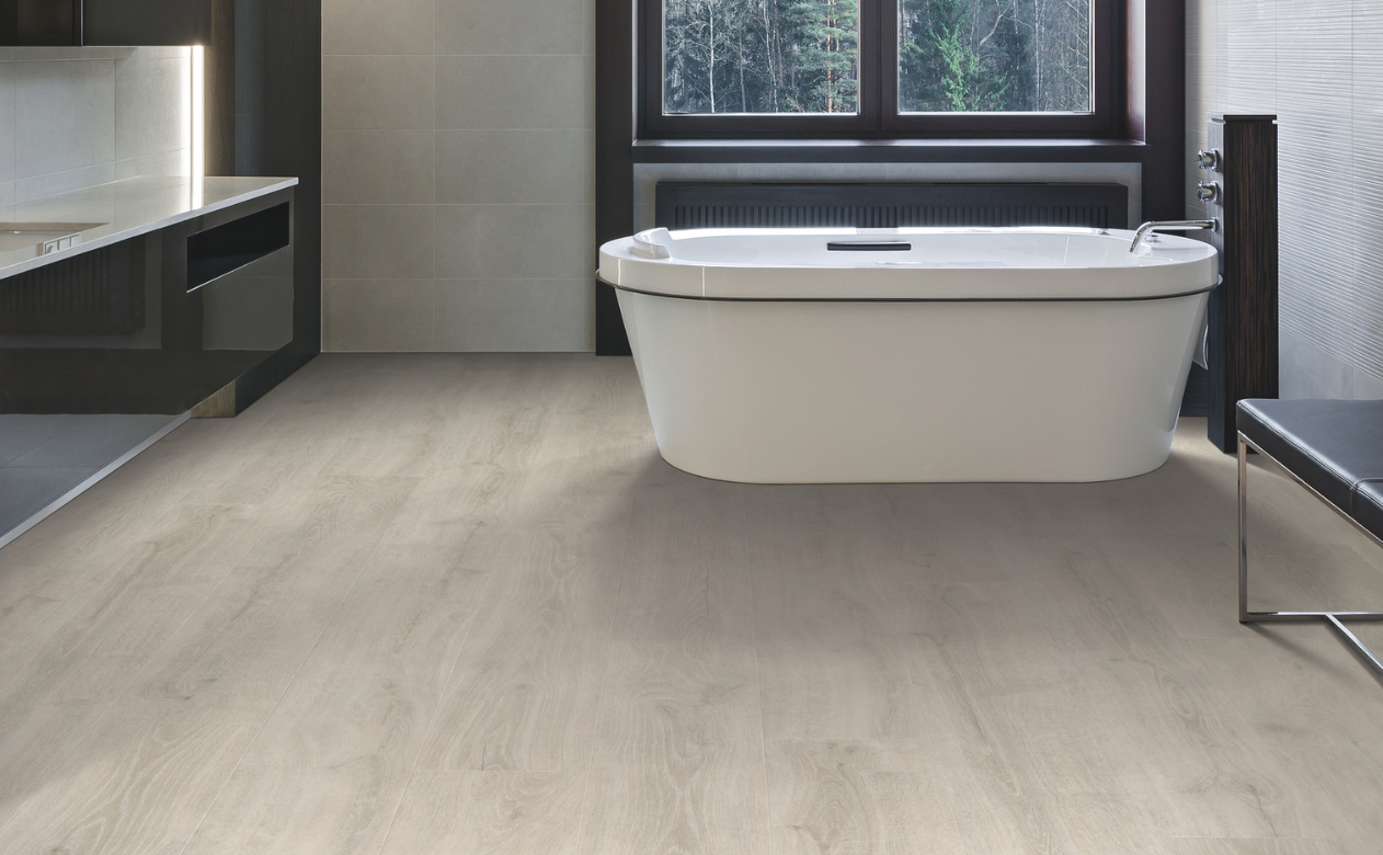 Bathroom with freestanding tub and wood-look laminate